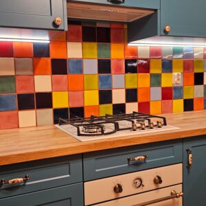 Energetic Kitchen in the Colors of Mexico | Every shot of this arrangement shows attention to detail and love for craftsmanship. The presented ceramic tiles, in the form of a vibrant mosaic, provide a perfect starting point for creating a cohesive interior, where Mexican sinks could also be added. A hand-painted countertop or inset sink would naturally complement this style, introducing more traditional Talavera patterns. Choosing colorful patchwork and sanitary ceramics from the same stylistic line creates an interior with a unique soul.
Product: https://www.cerames.eu/monocolour-tiles-78